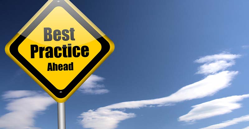 A photo of a road sign taken on a clear day reads, "Best practice ahead".