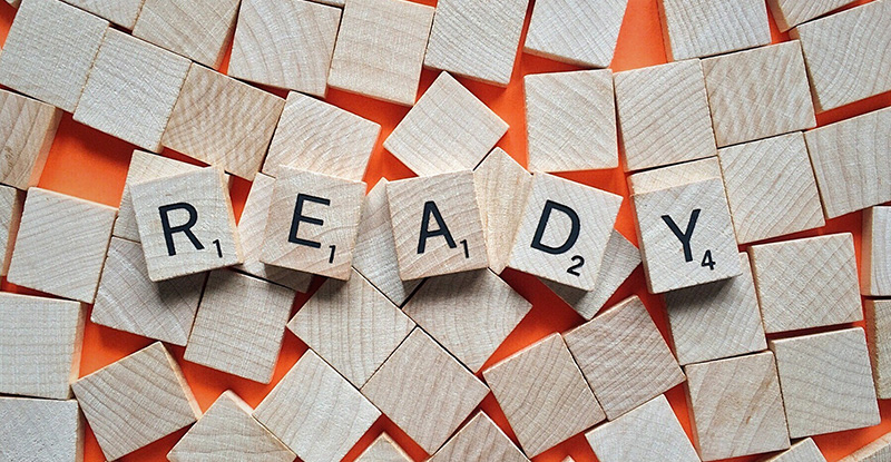 A photo of wooden blocks with letters that read "Ready".