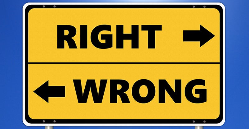 A photo of a signboard with the word 'Right' and an arrow pointing right, and below it, the word 'Wrong' with an arrow pointing left.